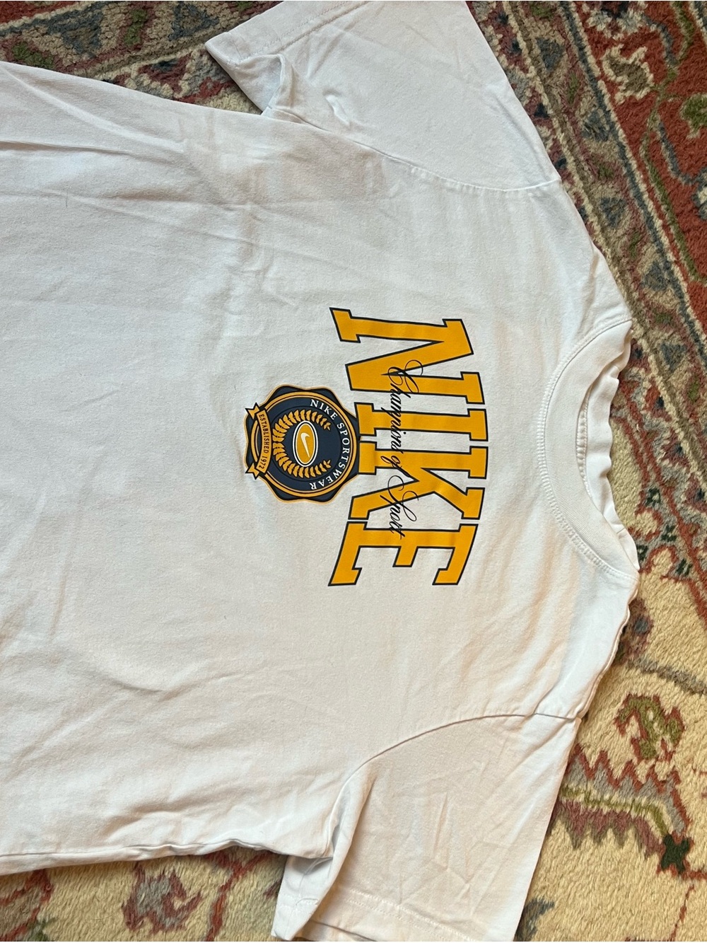 Nike White Short-Sleeve Logo T-Shirt with Yellow Crest cropped